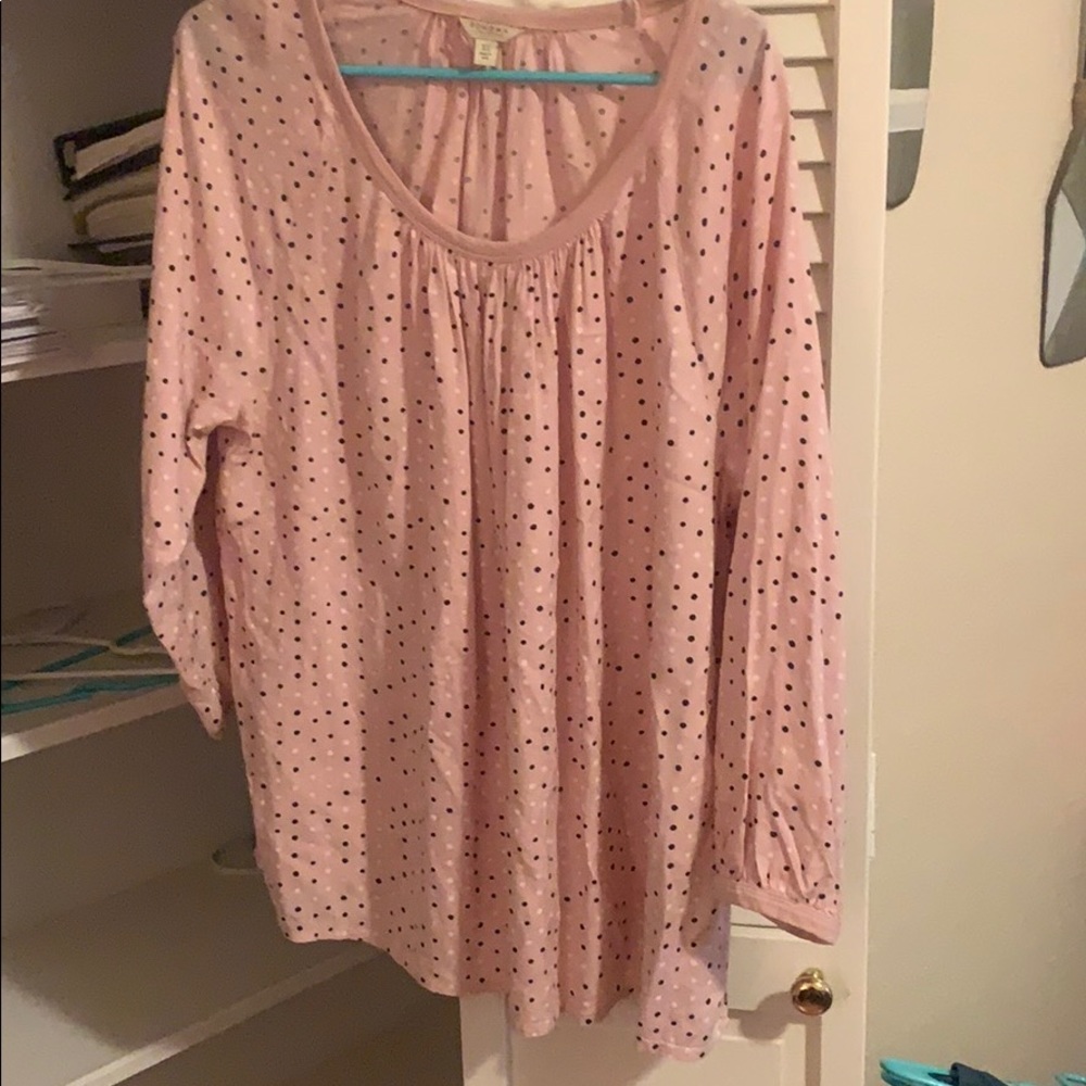 Pink shirt with black and white polka dots